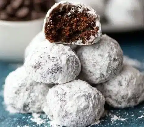 Delicious Chocolate Snowball Cookies coated in powdered sugar