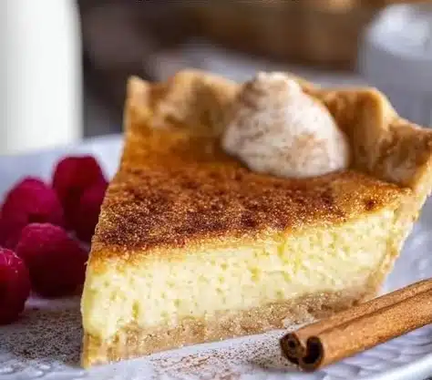 Cinnamon Vanilla Custard Pie served on a rustic wooden table