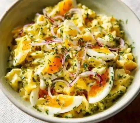 Foolproof Egg Salad 18 Foolproof egg salad served in a bowl with fresh herbs and spices