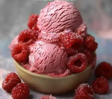 Delicious bowl of homemade Raspberry Ice Cream topped with fresh raspberries